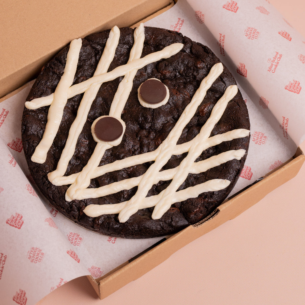 A giant double chocolate cookie decorated as mummy