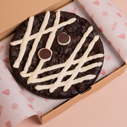 A giant double chocolate cookie decorated as mummy