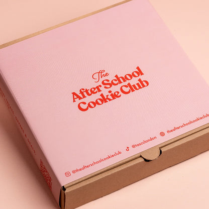 Pink box with 'The After School Cookie Club' text on a light pink background