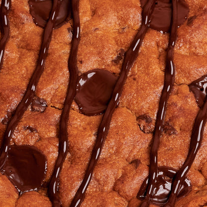 Detail of Giant Chocolate chip Cookie in a box on pink background