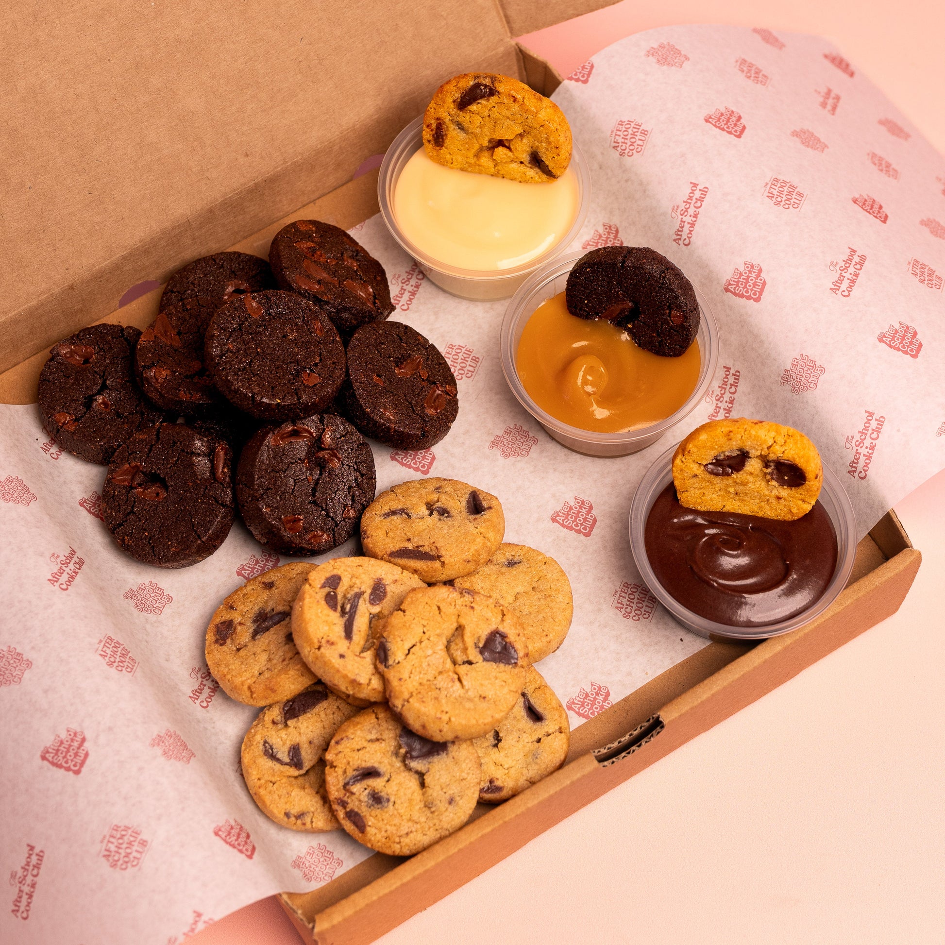 Box of mini cookies with 3 dipping pots on branded paper