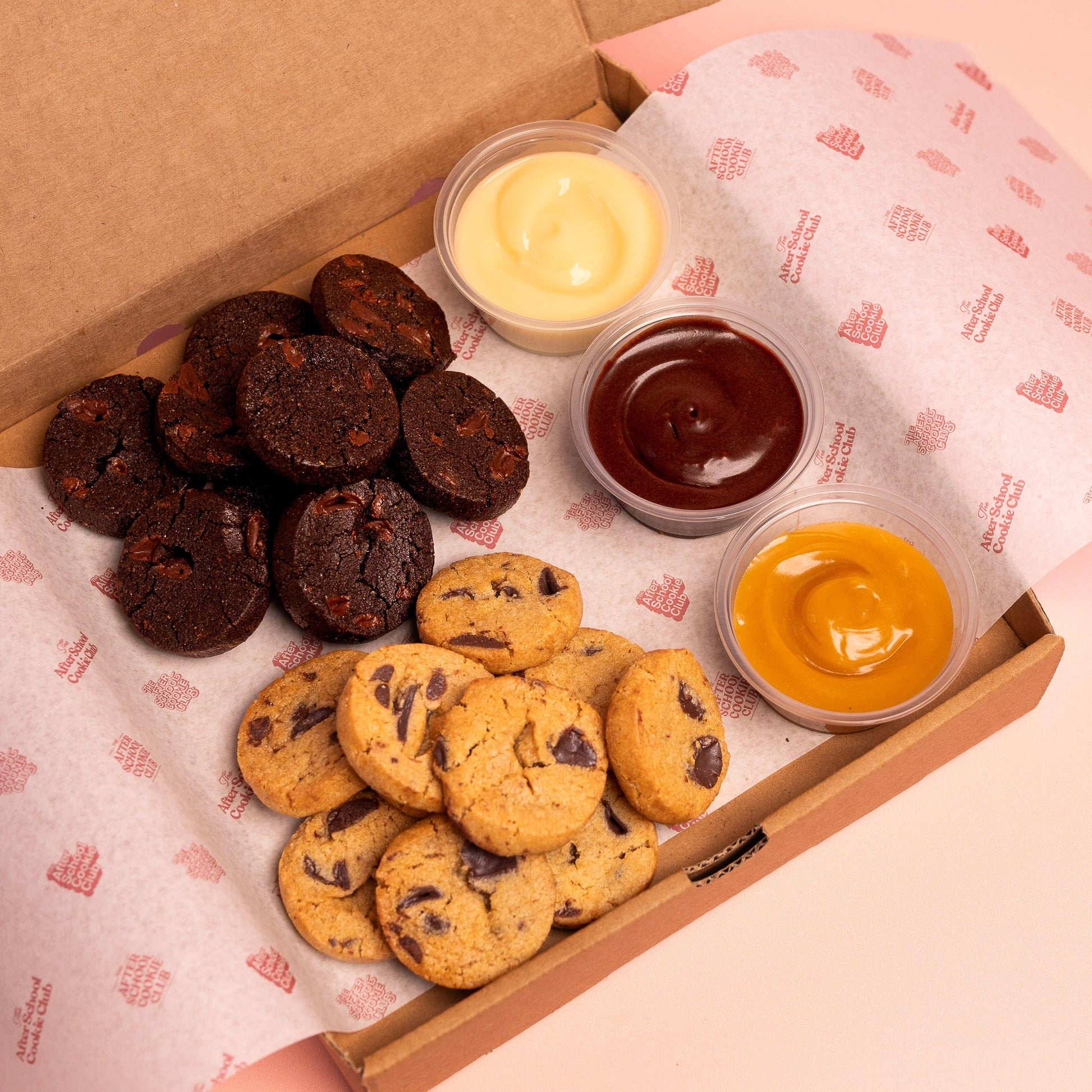 Box of mini cookies with 3 dipping pots on branded paper
